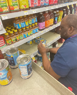 Neil Sanders stocks shelves at Walgreens in West Seneca