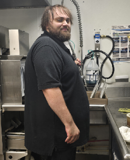 Christian Lippert washing dishes at The Brothers of Mercy Wellness Campus