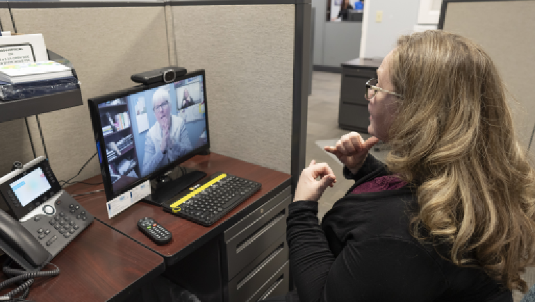 Jodie Chibi interprets for a client through Video Remote Interpreting (VRI).