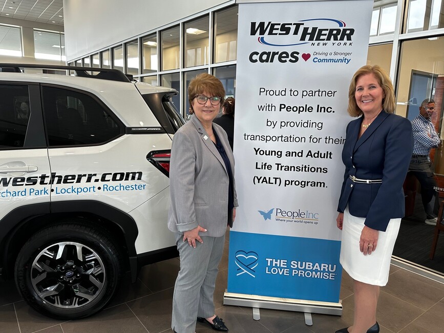 Anna Korus, People Inc. senior vice president and Anne McCaffrey, People Inc. president and CEO accept a donation from West Herr Automotive Group.